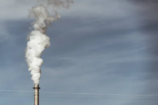 smoke stacks emitting carbon pollution into the sky causing climate change