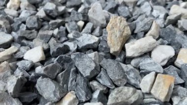 Pek çok küçük taşın doğal desenli arka planı.