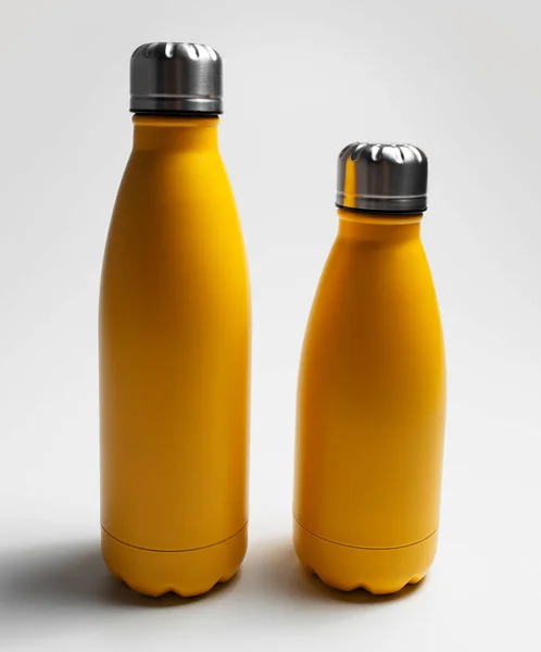 Close Big Small Yellow Reusable Eco Water Bottles Grey Background — Stock Photo, Image