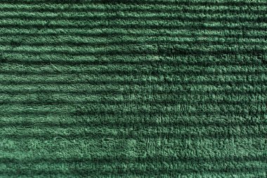 Gölgelerden çizilmiş yeşil havlunun doğal soyut arka planı.