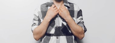 Close-up of man in grey shirt. Panoramic banner view.