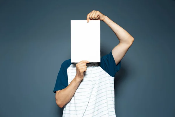 Studio Portrait Man Holding Empty Vertical Paper Board Face Copy — Stock fotografie