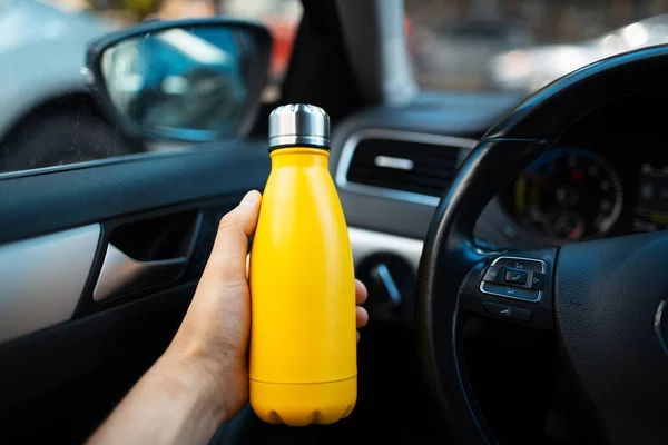 Close Male Hand Holding Steel Reusable Water Bottle Yellow Car Immagine Stock