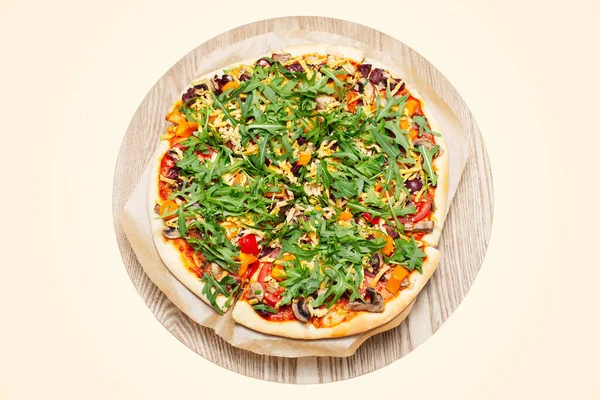 Close-up of vegan pizza isolated on pastel yellow background. Homemade food.