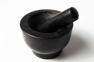 Close-up of granite stone grinder bowl of black, on white background.