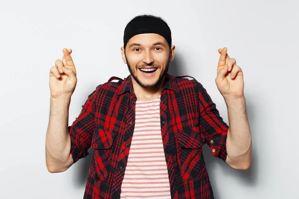 Studio Portrait Young Handsome Happy Man Crossed Fingers Wearing Red — Stock fotografie