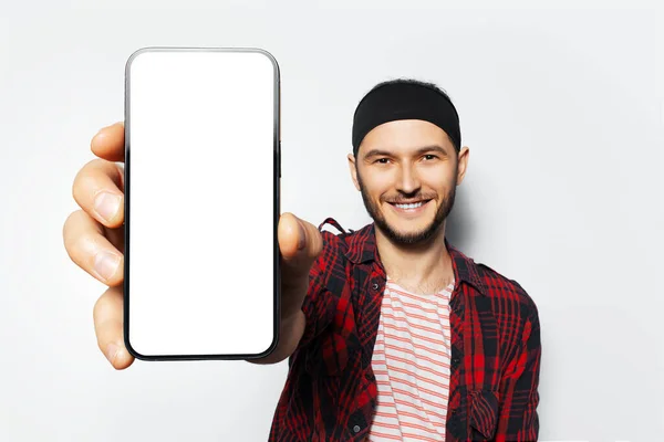 Studio Portrait Young Smiling Man Holding Big Smartphone Blank Screen — Stock fotografie