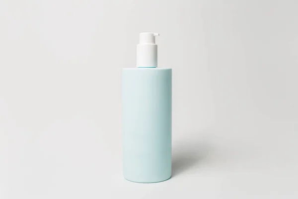 Close Dispenser Bottle Body Cream Cyan Color Isolated White Background — Stockfoto