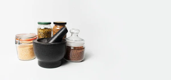Close Granite Stone Grinder Bowl Black Jars Some Spices White — Foto Stock
