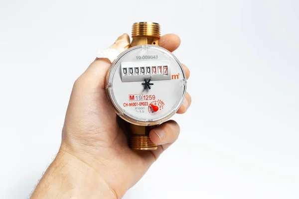 Close Male Hand Holding Water Meter Hot Water White Background — Zdjęcie stockowe
