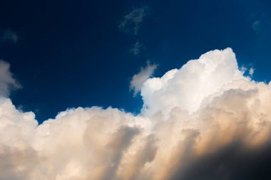 Beautiful landscape of cloudy sky, partial dark, fluffy clouds. Natural landscape.