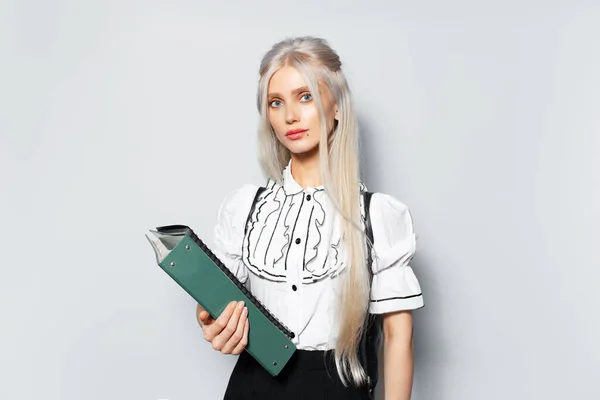Studio Portrait Young Blonde Girl Teenager Holding Folder White Background — Stock fotografie