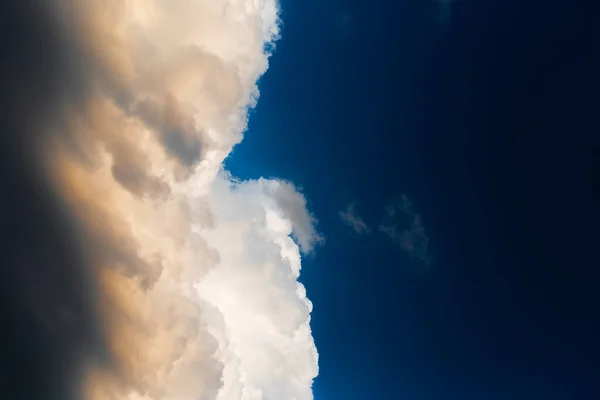 Beautiful landscape of cloudy sky, partial dark, fluffy clouds. Natural landscape.