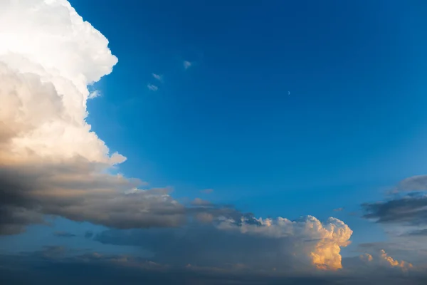 Beautiful landscape of cloudy sky, partial dark, fluffy clouds. Natural landscape.