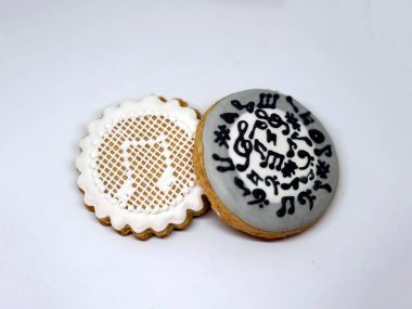 A collection of handmade honey cookies with musical notes on them