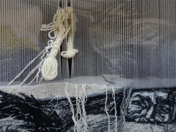 Weaving tapestry on a loom, manufacturing