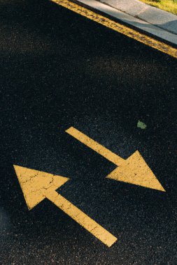 white road sign with arrow