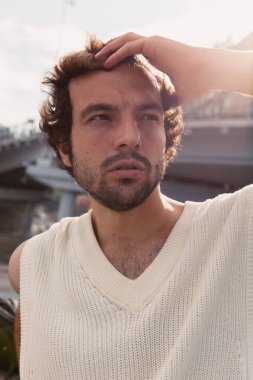 A stylish portrait of a charismatic man in the city 