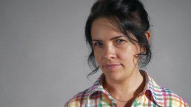 Pointing Index Finger Denying No Gesture Female Face Emotions Facial Expression. Portrait Woman against White Wall Background. Slow motion 4K