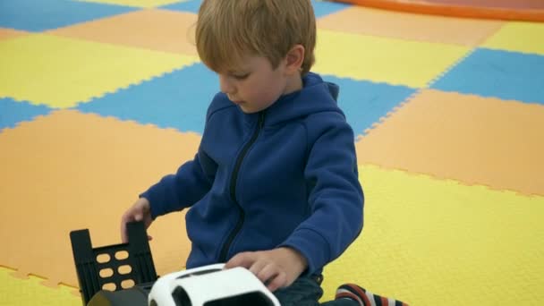 Cute Child Boy Plays Alone Indoor Kids Playground 인터넷 데이터베이스 — 비디오
