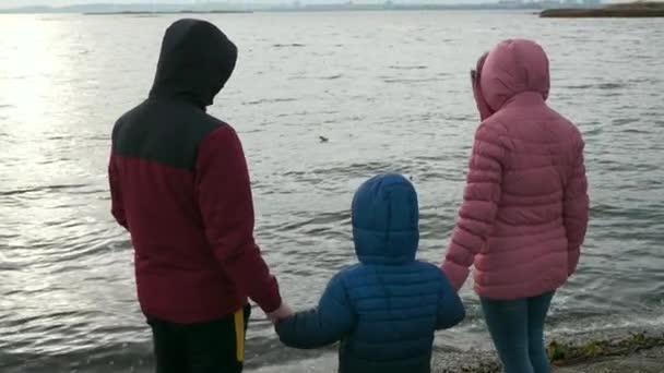 Family Father Mother Child Walk River Reservoir Jacket Hood Cold — стокове відео