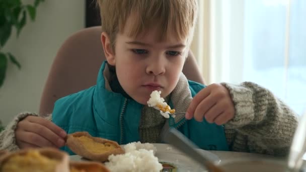 Child Eat Rice Canned Corn Kid Eating Meal Breakfast Dinner — Vídeo de Stock