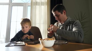 Father with Son Assemble Wooden Toy Truck Constructor. Dad with Child Spend Time Together Handcraft. Winter Holidays Sunny Day Home. 2x Slow motion 60fps 4K