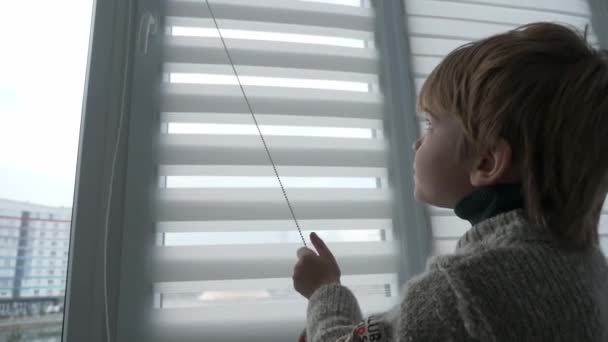 Little Boy Kid Opens Window Roller Shutter Blinds Curtain Cute — 图库视频影像