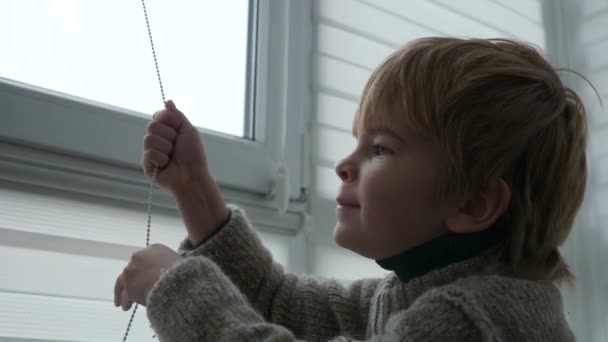 Little Boy Kid Opens Window Roller Shutter Blinds Curtain Cute — 图库视频影像