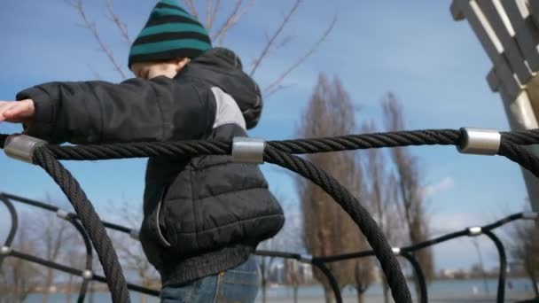 Kid Walks Climbs Children Playground Child Boy Plays Park City — Stock Video