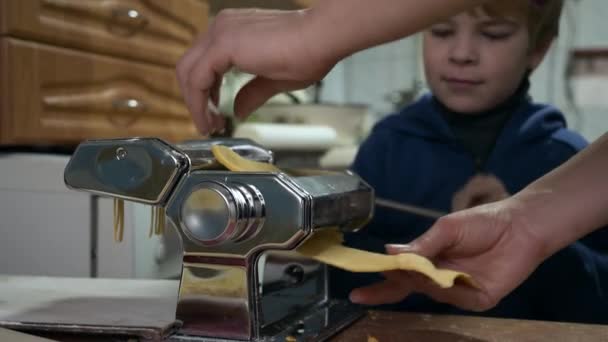 Little Boy Helps Mother Producing Pasta Vermicelli Spaghetti Woman Child — Stockvideo