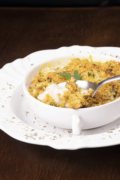 Fish Casserole Focus Spoon Showing Cheese Crispy Breaded Food Blurred — Stock Photo, Image