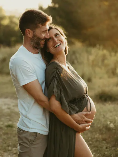 Side View Smiling Male Hugging Pregnant Female While Standing Countryside — Stock Photo, Image