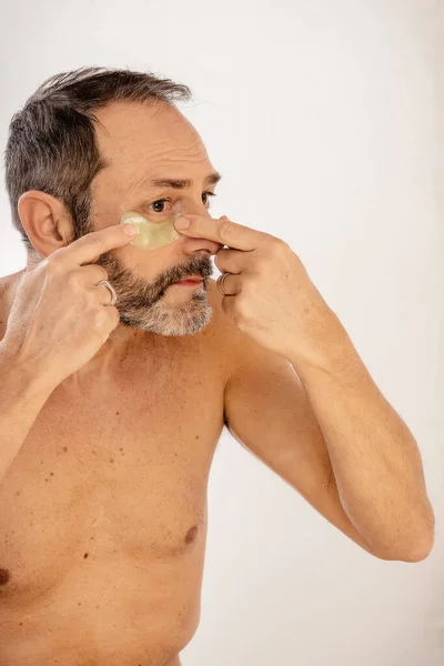 Crop Bearded Middle Aged Male Naked Torso Applying Eye Patch — Stock Photo, Image