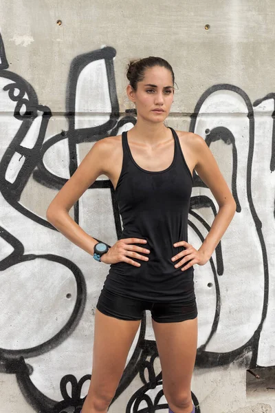 Positive Athletic Female Runner Sportswear Leaning Wall While Taking Break — Stock Photo, Image