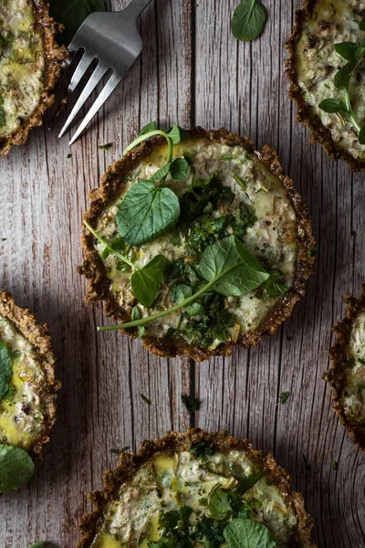 Top View Cauliflower Walnut Cakes Greens Fork Planked Wooden Table — Stock Photo, Image