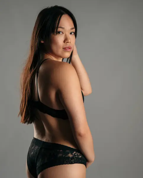 Confident Asian Female Black Lingerie Standing Gray Background Studio Looking — Stock Photo, Image