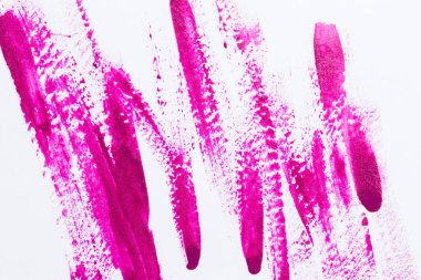 Beyaz arka plan üzerindeki oje şeritler ve damlalar şeklinde.