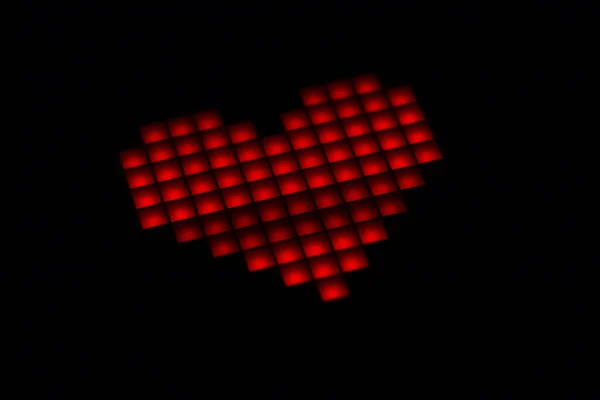 Primer plano del corazón sobre un fondo negro. Día de San Valentín — Foto de Stock