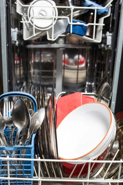 Dishwasher with dirty dishes closeup. Household kitchen appliances. Assistant hostess. — Stock Photo, Image
