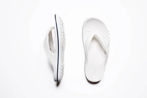 Flip flops on a white isolated background. White female flip flops. — Stock Fotó