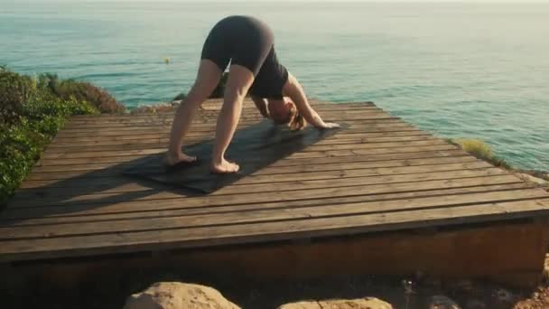 Young Woman Practices Yoga Background Sea Summer Day — Stockvideo