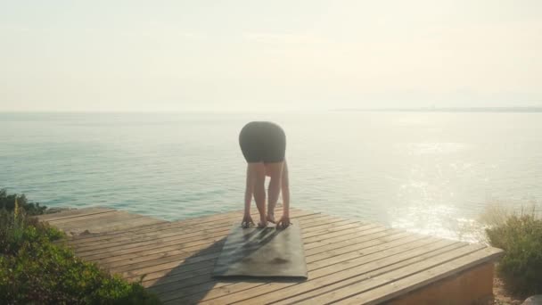 Young Woman Practices Yoga Background Sea Summer Day — Stockvideo