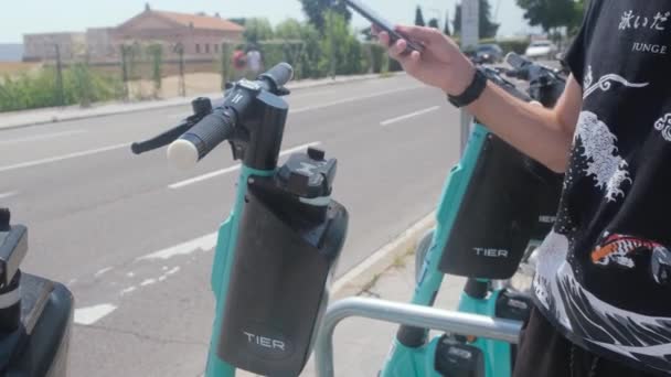 Tarragona Spain June 2022 Scanning Code Smartphone Rent Electric Scooter — Vídeos de Stock