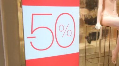 50 percent discount on lingerie shop window.