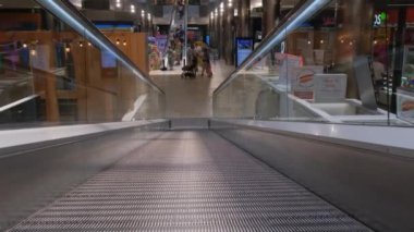 Tarragona, Spain - June 01, 2022: Moving escalator in a shopping mall.