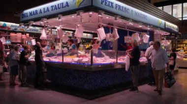 Tarragona, Spain - June 01, 2022: Seafood market, buyers buy and choose fish.