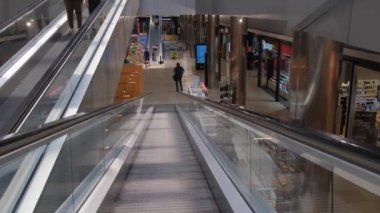Tarragona, Spain - June 01, 2022: Moving escalator in a shopping mall.