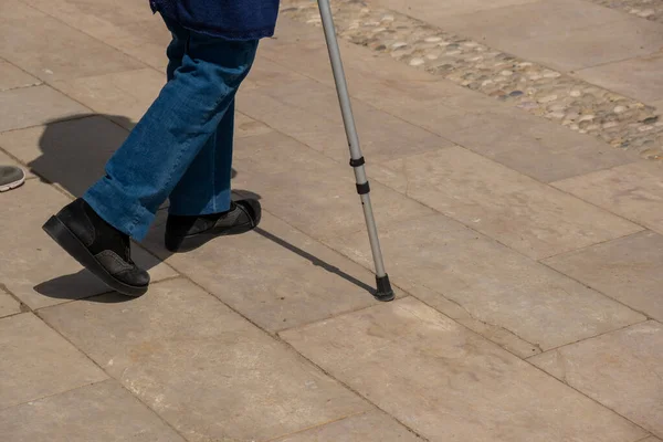 Legs Walking Elderly Woman Embankment Cane Her Hands — стоковое фото