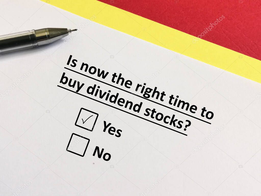 One person is answering question about investment. He thinks it  is now the right time to buy dividend stocks.